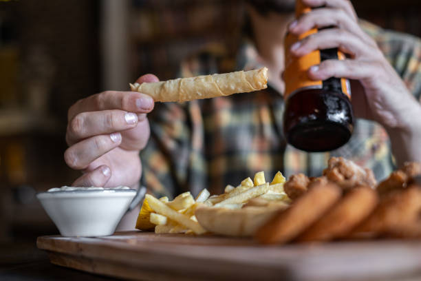 Fried chicken and french fries on wooden board - Beer Table
