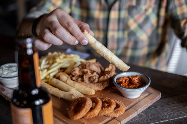 Fried chicken and french fries on wooden board - Beer Table