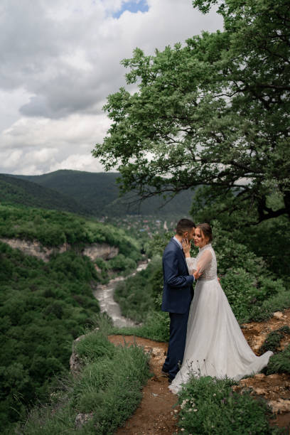 istock a beautiful hugging newlyweds in a wedding ceremony in the mountains 1340116966