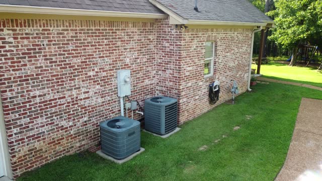Modern Air Conditioner systems next to home