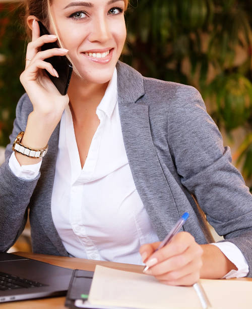 istock Happy woman using chatting with mobile and use laptop computer 1340119357
