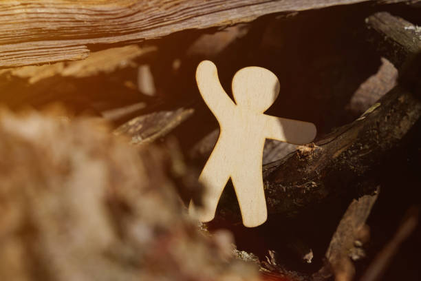 istock A wooden man lost in the forest calls for help. 1340119671