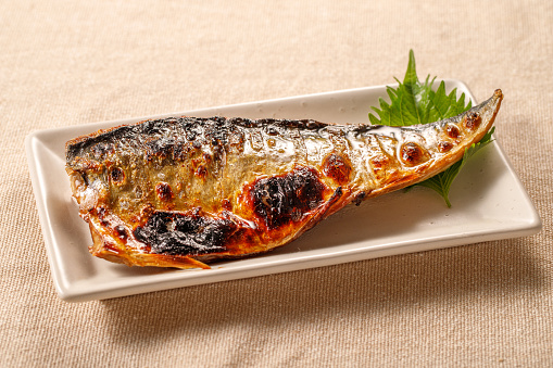Grilled mackerel on a white plate