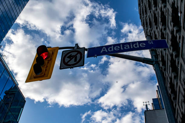 istock Red Traffic Light And Street Sign (Adelaide street) Toronto 1340129181
