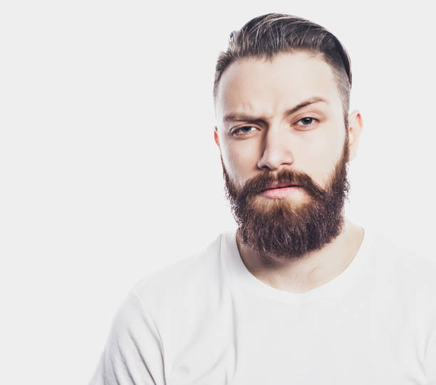 istock Young bearded man over white background. Lifestyle and people concept 1340135755
