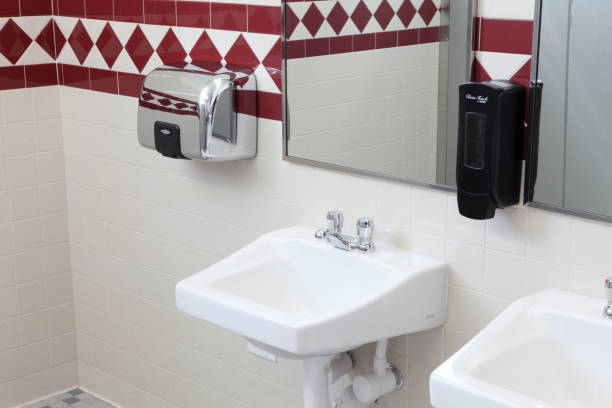 istock Wash basins in  a public restroom 1340136940