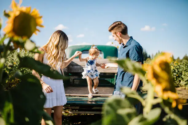 Photo of Cute Young Family In Cornfield