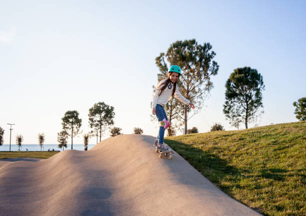 istock Girl skateboarding 1340138172