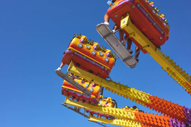 istock people riding on a carousel in an amusement park 1340140033
