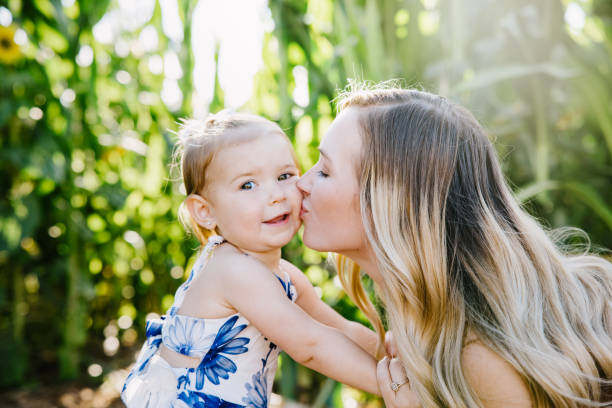 istock Cute Mother and Daughter in Cornfield 1340140148