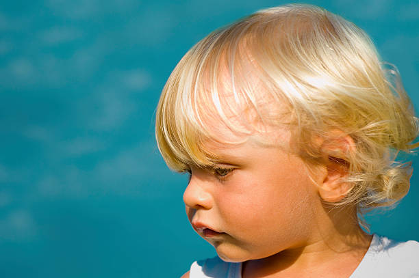 istock little blond boy at the beach 134014264