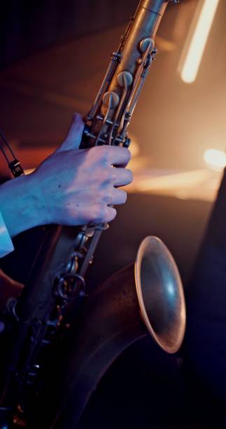 istock Hand of a man who is playing saxophone 1340145568