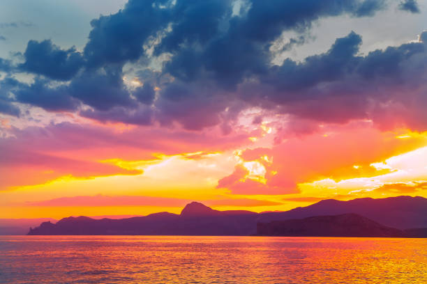 istock Dawn in a beautiful cloudy sky over the sea 1340145820