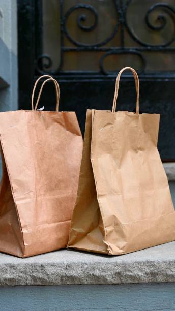 istock Paper bags in front of a house 1340146833