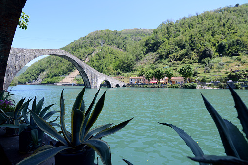 Ponte della Maddalena, a bridge crossing the Serchio river near the town of Borgo a Mozzano in the Italian province of Lucca. It's one of numerous medieval bridges known as Ponte del Diavolo, the 