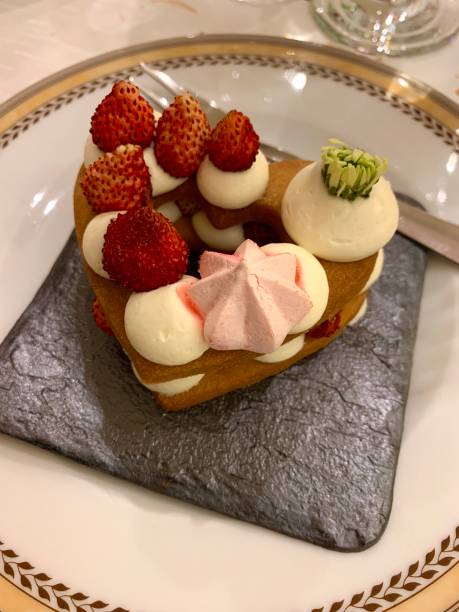 istock Sweet heart-shaped single portion with cream and strawberries 1340155511
