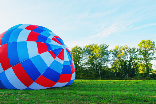 Hudson Valley, NY. USA. 08.07.2018 Hot air balloon festival in Hudson Valley New York, on a beautiful sunny day with lots of people helping, participating, flying and enjoying themselves like the lovely joyous people that they are!