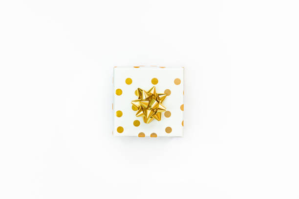 istock Top view of a golden dotted gift box on a white background. 1340167589