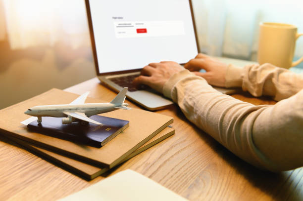 istock Flight status, Asian female student abroad checking flight status and Preparation Passport with Digital Documentation of COVID-19 Certificate in College for study at university. Focusing on Airplane. 1340170450