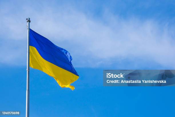 Ukrainian National Flag Flutters In The Wind Against The Blue Sky National Symbol Of Ukrainian People Blue And Yellow Banner Is Fluttering In The Wind Stock Photo - Download Image Now