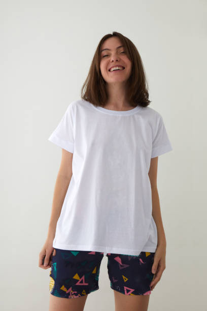 istock Happy woman in pajama in studio laughs 1340171033