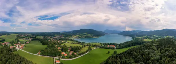 Photo of Bavarian recreation area of the Tegernsee, the view at the alps from a high angle view of a drone at a beautiful summer day with the Gut Kaltenbrunn in the foreground.