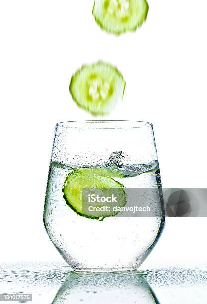 Cucumber Falling Into Glass Of Water Stock Photo - Download Image Now - Clean, Cold Drink, Cold Temperature