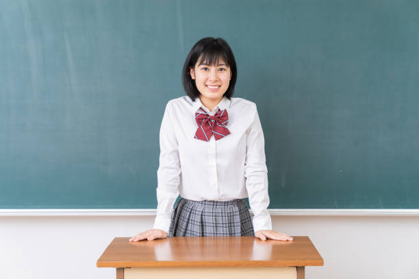 istock young asian school girl,blackboard 1340176733
