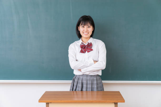 istock young asian school girl,blackboard 1340176831