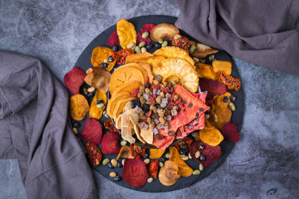 istock Dried fruits and vegetables, dehydrated persimmon, watermelon, pineapple, beetroot chips 1340177033