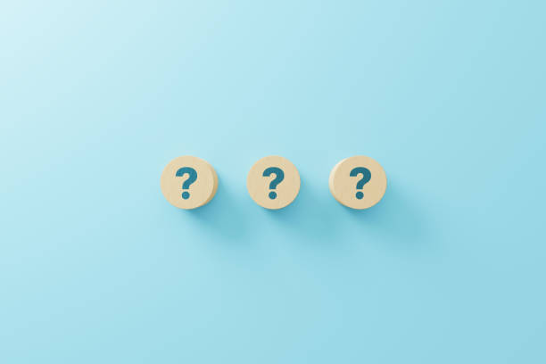 istock Wooden block shape with sign question mark symbol on blue background. 3d render illustration 1340179668