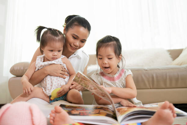 istock Mother And Daughters Looking at Photos 1340179942