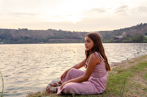 Pensive Girl at Lake