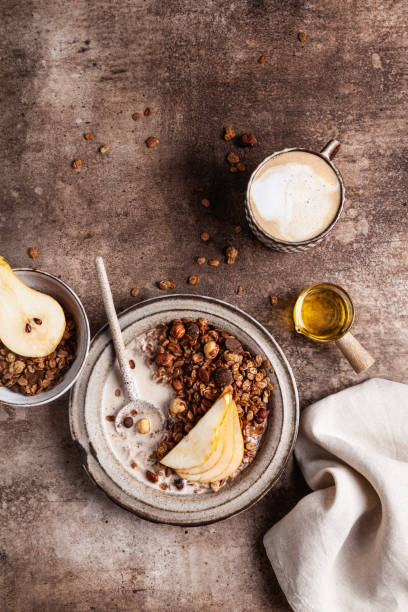 istock Chocolate granola with almond milk, pear and honey. 1340183254