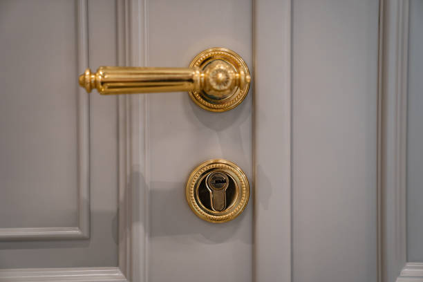 istock door handle and lock of gold color. classic interior. 1340183316