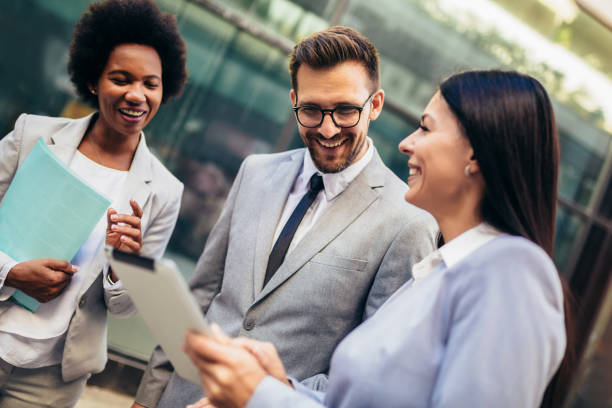 istock Group of business team meeting outside 1340186575