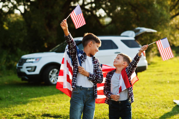 istock Two brothers with USA flag 1340188322