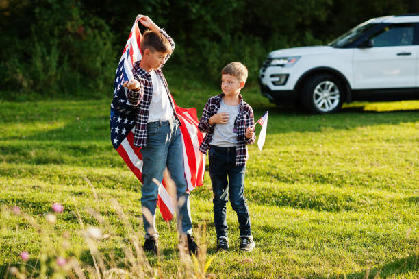 istock Two brothers with USA flag 1340188494