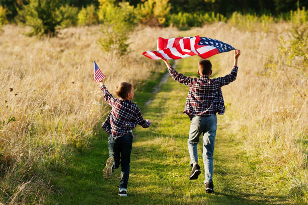istock Two brothers with USA flag 1340188533