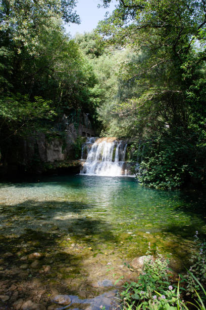 istock Waterfall on a River in a Fairy Forest, Italy 1340188679