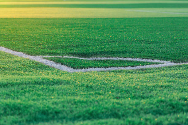istock White corner lines on an empty football field during sunset 1340188706
