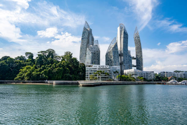 istock Singapore skyline with luxurious skyscraper homes, ocean and rainforest 1340189626
