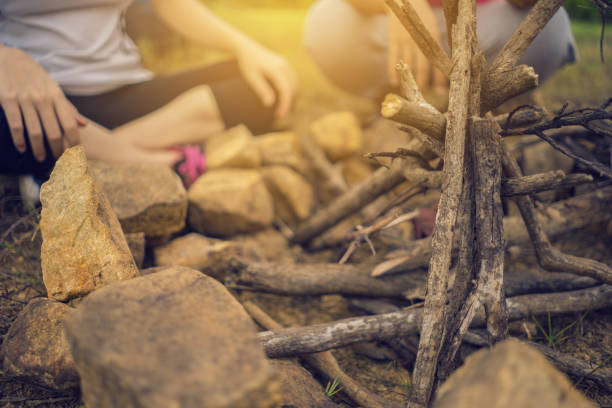 istock Preparation wood for bonfire. camping concept. 1340189736