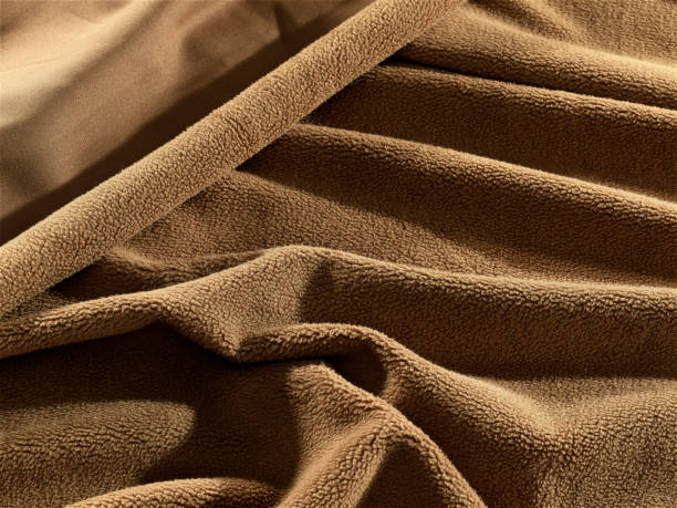 istock Background Texture, background, pattern, Cloth pleated blue. A shiny finished folded satin fabric is a light, glossy glossy and beautiful type of fabric that makes the design of the end stylish and glamorous 1340190686