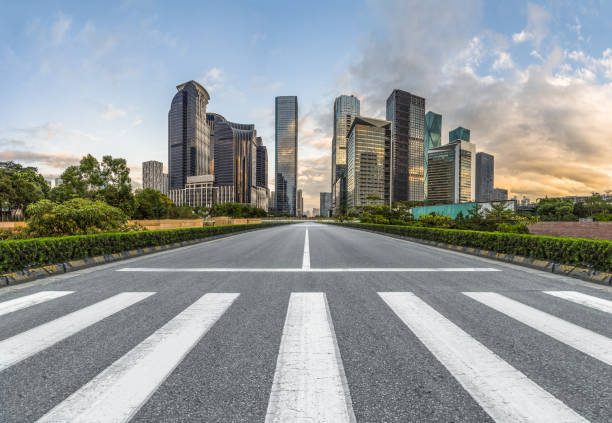 istock empty road with zebra crossing and skyscrapers in modern city 1340191034
