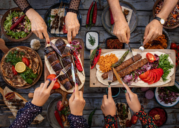 Many types of kebap on the table like adana kebabı and patlıcan kebabı Dining table with family and friends. lebanese culture stock pictures, royalty-free photos & images