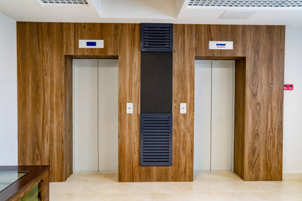 istock two elevator doors In a hall. modern interior of an apartment building 1340195778