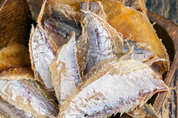istock dried and butchered small fish on a wooden table 1340201339