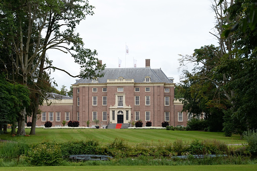 Slot Zeist is a seventeenth-century castle in the Dutch municipality of Zeist that was built as a pleasure place by Willem Adriaan van Nassau. The castle was designed by architect Jacobus Roman. The castle is surrounded by an English landscape park and the Broeder- en Zusterplein. (\