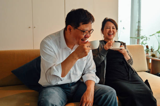 istock Mature asian couple having a coffee on Christmas 1340202729